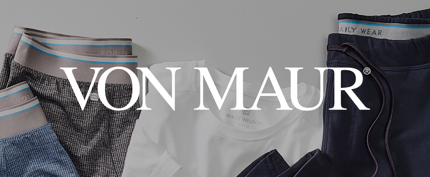 boxer briefs, shirt, and sweatpant laid out with a "Von Maur" logo across the image