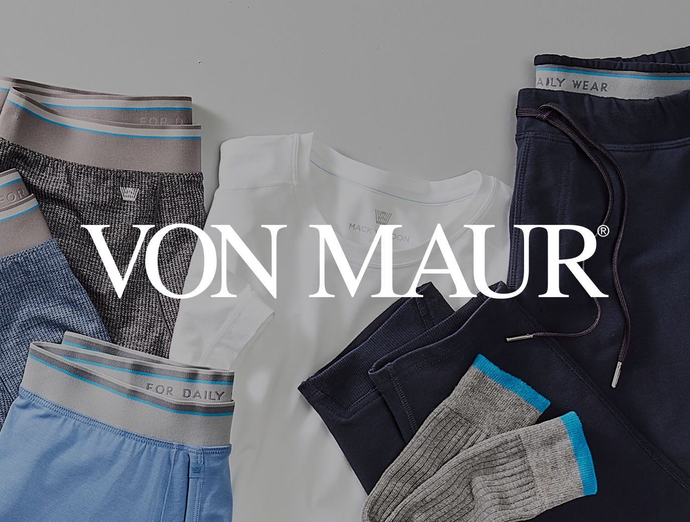 boxer briefs, shirt, and sweatpant laid out with a "Von Maur" logo across the image