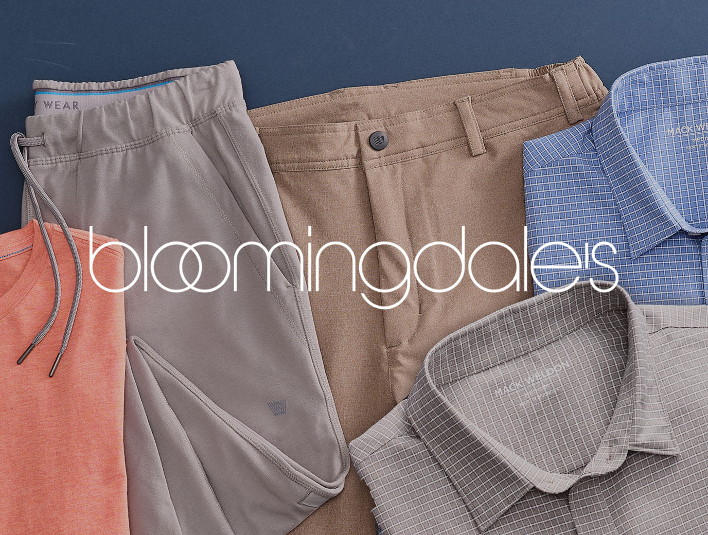 Image with tops and pants laid out with a "BLOOMINGDALES" logo across the image